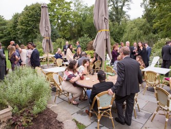 Guests standing and mingling at cocktail hour on the patio, A Guy + A Girl Photography